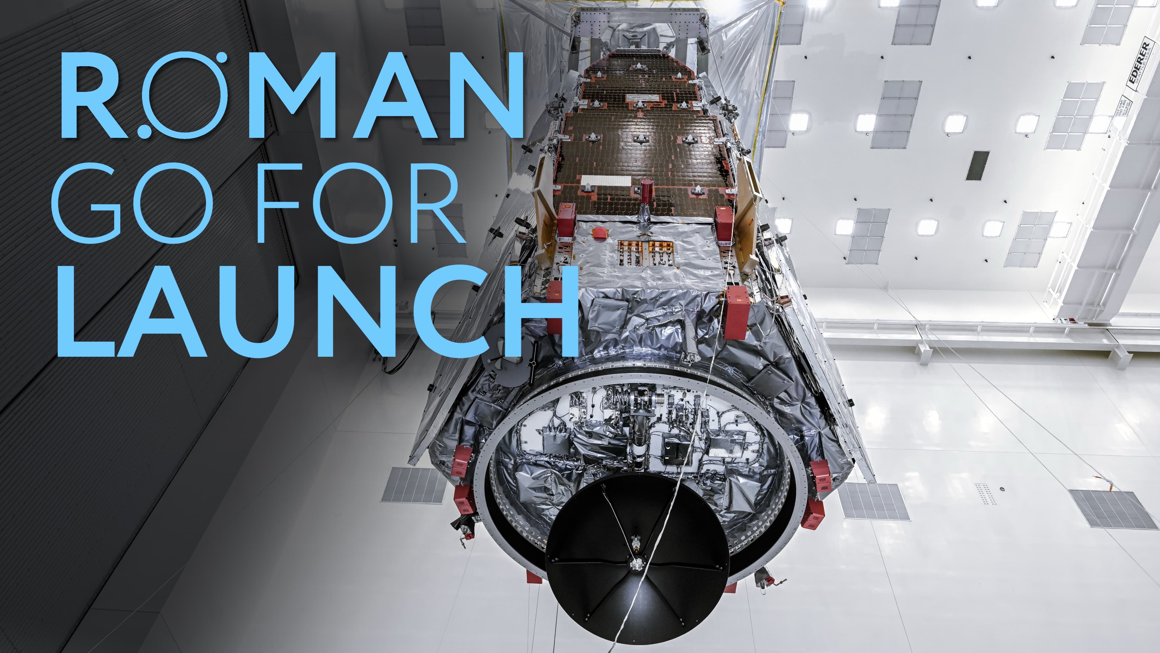 Illustration promotionnelle de la NASA « Roman Go For Launch » montrant le télescope spatial Nancy Grace Roman en salle blanche avant son lancement